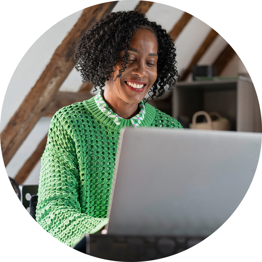 Smiling at Laptop