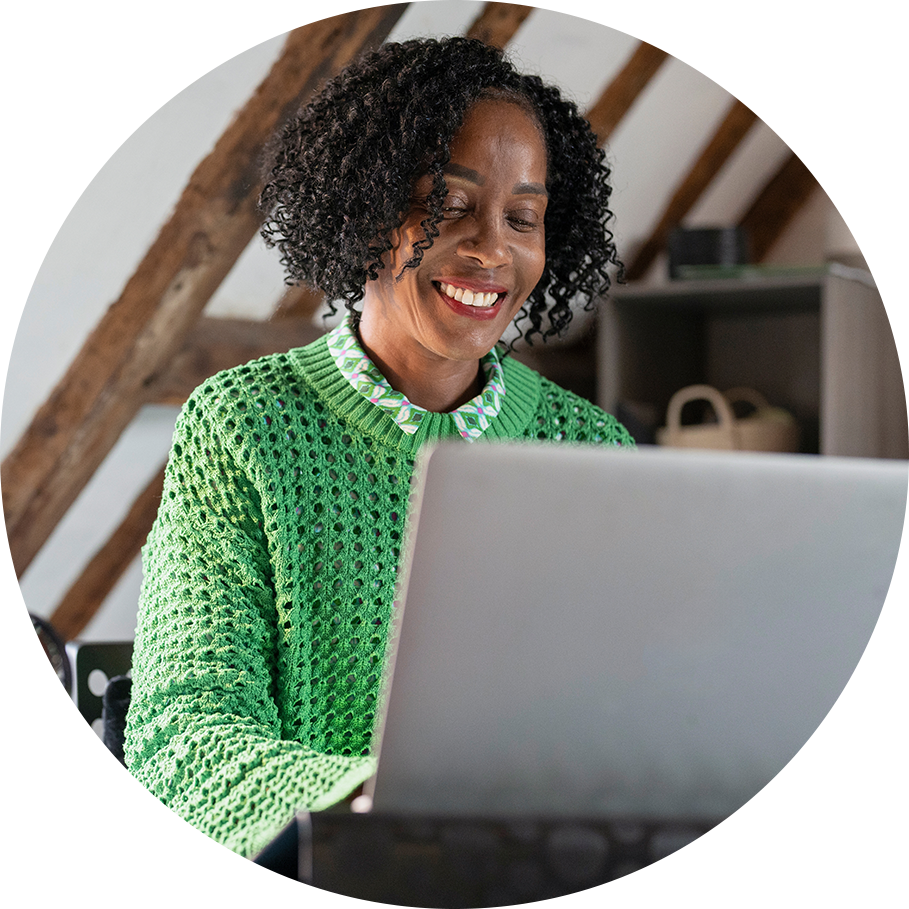 Smiling at Laptop